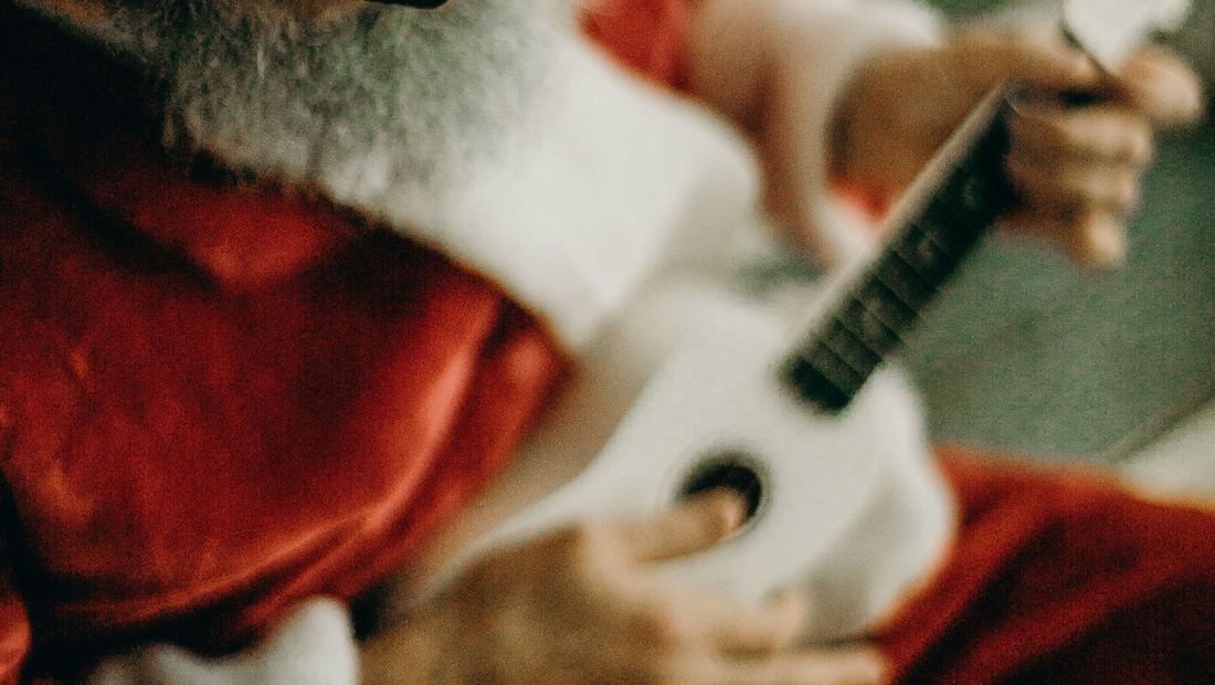 santa playing white ukulele